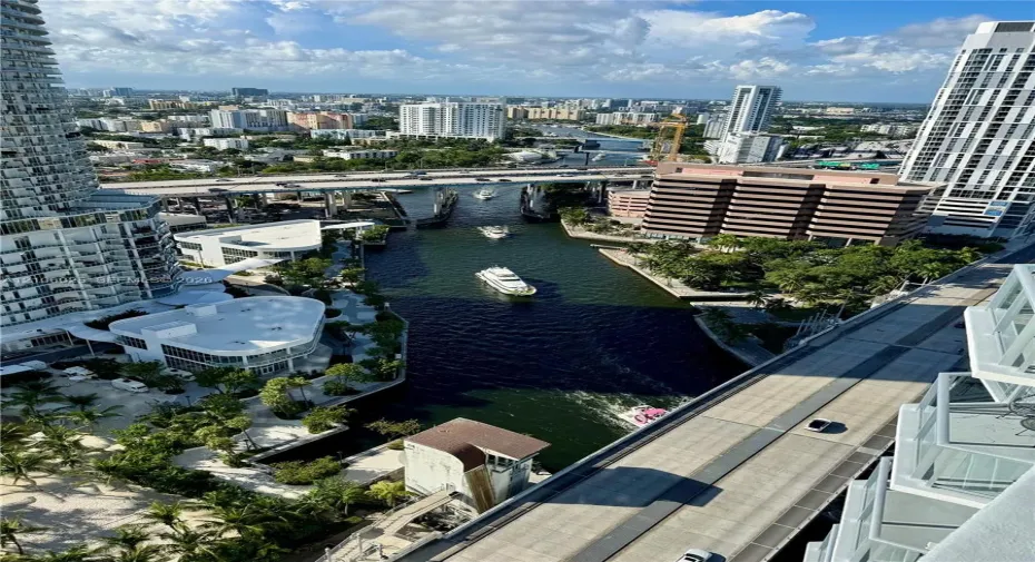 High-rise perspective featuring an urban cityscape with waterway access and multi-story high-rise architecture