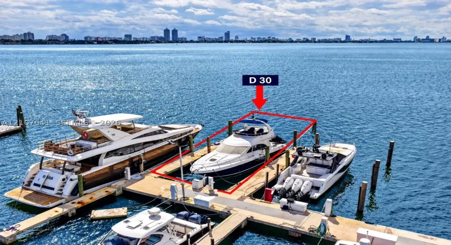 Deeded boat slip D 30 featuring fixed wooden pilings and direct waterway access