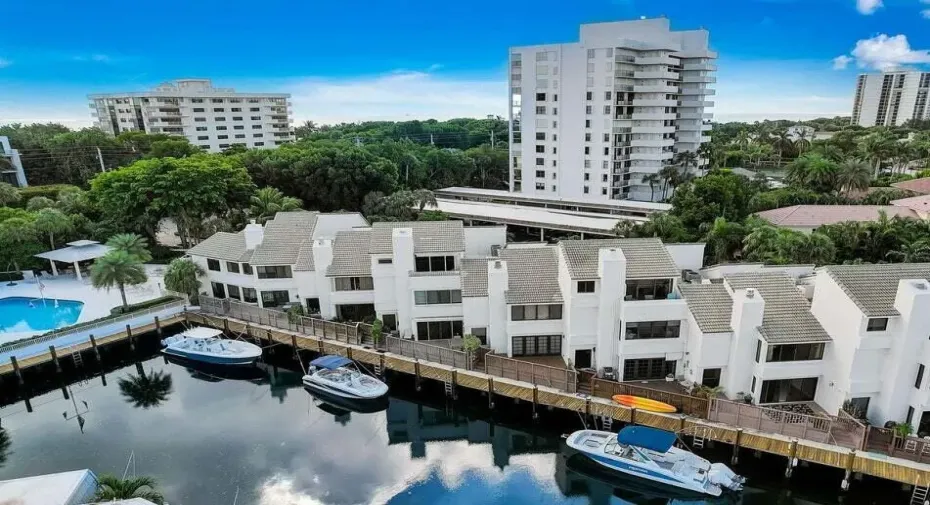 Waterfront residences featuring private boat slips, multi-level design, and direct water access