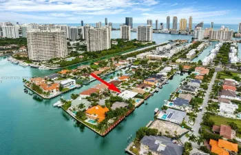Waterfront property featuring deep-water access, canal frontage, and mature palm trees