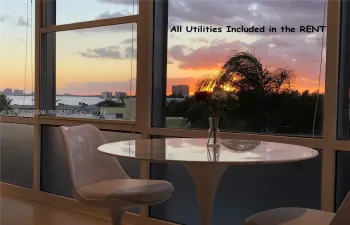 Floor-to-ceiling windows providing extensive natural light and expansive water scenery