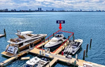 Deeded boat slip D 30 featuring fixed wooden pilings and direct waterway access