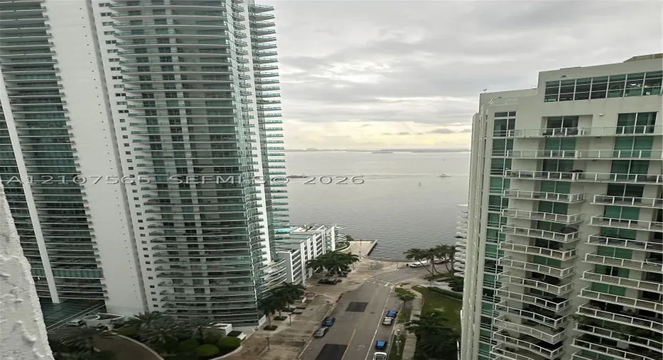 High-rise towers featuring wrap-around glass balconies and open water frontage