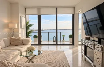 Floor-to-ceiling windows, polished tile flooring, and a private balcony featuring metal railings