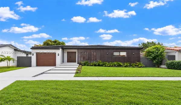 Contemporary single-story exterior featuring dark wood-tone vertical siding, a concrete paver walkway, an integrated single-car garage, and a manicured front lawn