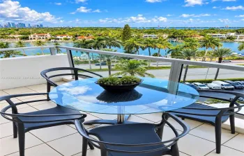 Private balcony featuring large-format tile flooring and metal-framed glass railings