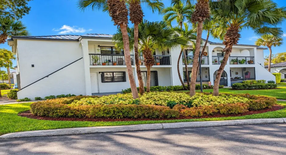 Tropical Palm-Framed Condominium Exterio