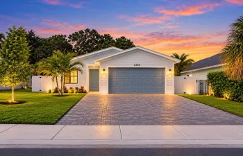Twilight Coastal Home with Warm Lighting