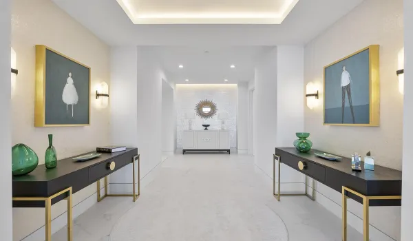 This is the stunning foyer as you walk into the Penthouse, The entry double doorway is to the right of the gold circle Foyer mirror, This entryway is one of 2 double door entryways on the top floor of the Cristelle tower entryways into the penthouse, The 4ft by 4ft European porcelain flooring with designer decorations & tray ceiling lighting throughout, All designer furniture is an additional negotiation,
