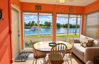 Luminous Waterfront Dining Room with Pas