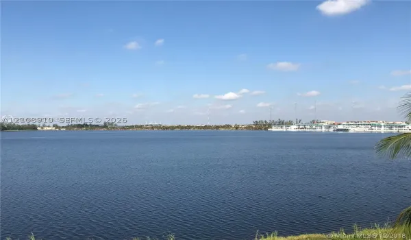 Expansive lake frontage with natural shoreline vegetation