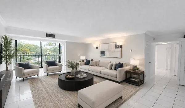 Living area featuring ceramic tile flooring, floor-to-ceiling glass sliding doors, private balcony, crown molding, and dual wall-mounted light fixtures