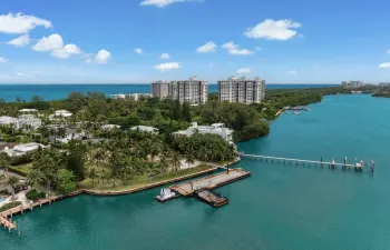 Waterfront property featuring extensive private dockage, deep-water access, seawall bulkhead, and mature coastal vegetation