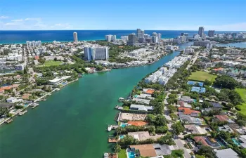 Aerial perspective featuring a waterfront location with direct canal access to the ocean and proximity to the coastline