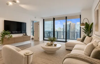 Living space featuring floor-to-ceiling windows, wood-finish flooring, a wall-mounted floating media console, and a balcony with metal railing