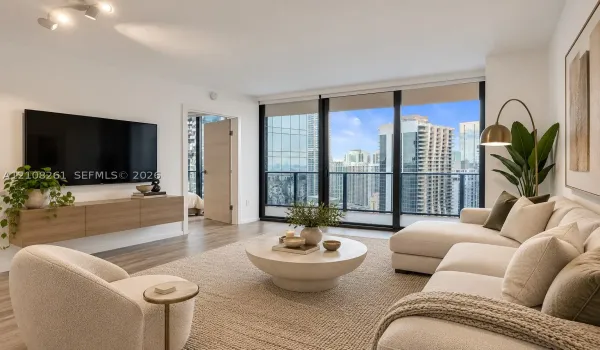 Living space featuring floor-to-ceiling windows, wood-finish flooring, a wall-mounted floating media console, and a balcony with metal railing