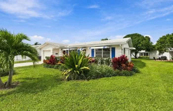 Beautiful landscaping and located on an oversized lot