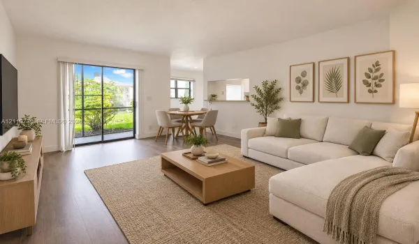 Living space featuring wood-finish flooring, neutral walls, sliding glass door, and a kitchen pass-through window