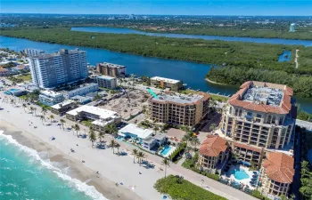 Aerial perspective featuring proximity to the coastline, waterfront access, and surrounding coastal landscape