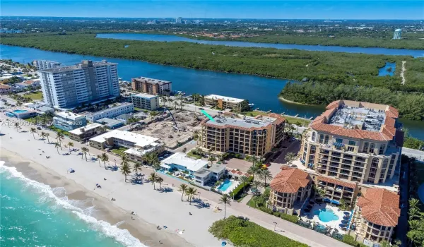 Aerial perspective featuring proximity to the coastline, waterfront access, and surrounding coastal landscape