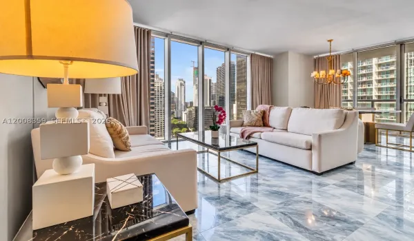Full-height windows, polished tile flooring, built-in chandelier, and a spacious open-concept layout. ( stage )