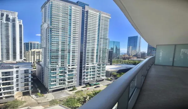Covered balcony featuring concrete flooring and glass panel railings