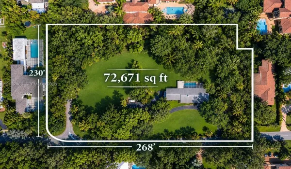 Expansive 72,671 square foot lot featuring a private swimming pool, mature trees, manicured lawn, and a circular driveway