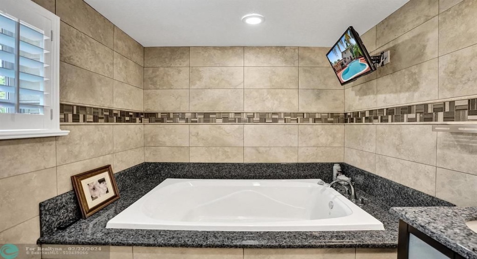 Get a book or the remote and escape from the rest of the house. Huge soaking tub for complete relaxation.
