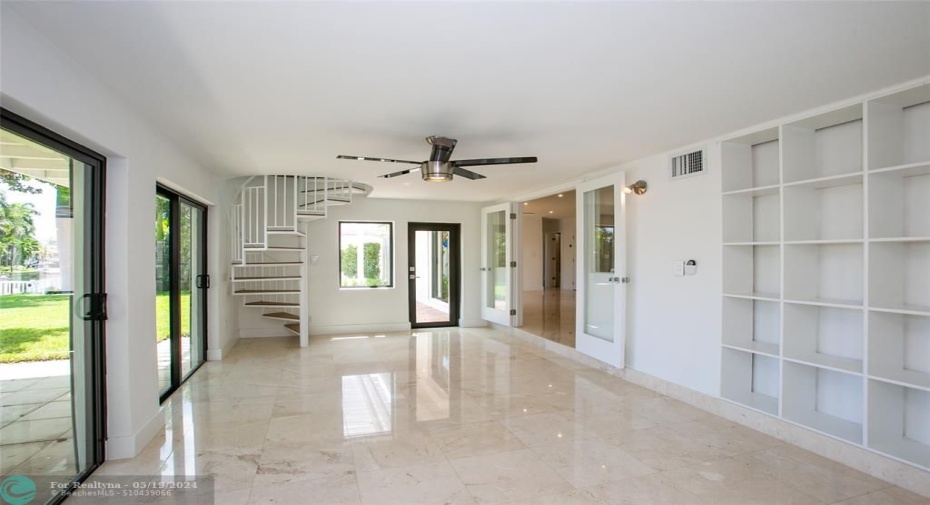 Florida room with spiral stair case