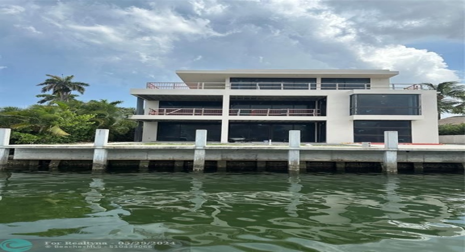 View from the water showing the exterior back elevation