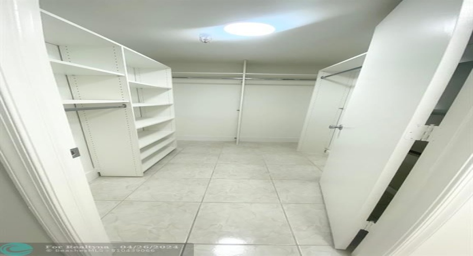 Extra Large Master Bedroom Walk In Closet with Built Ins!