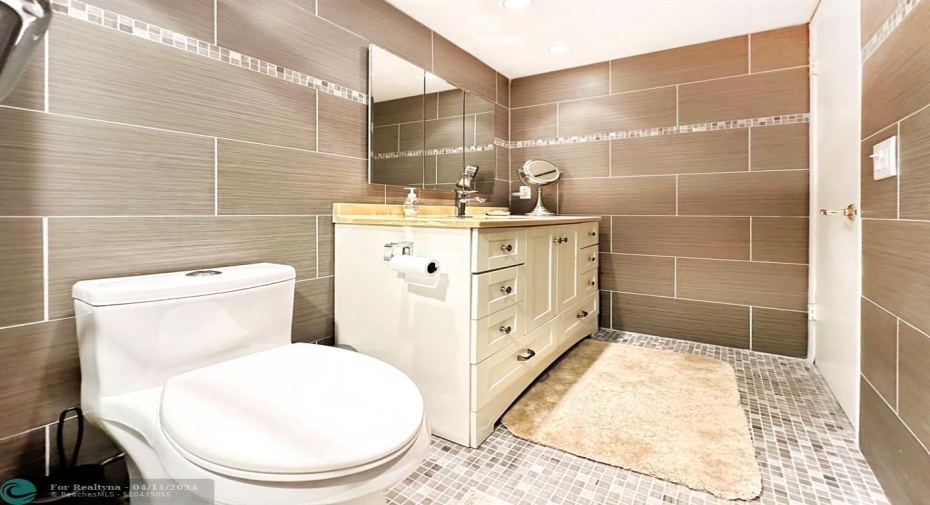 Tiled Walls Enhance this Bathroom