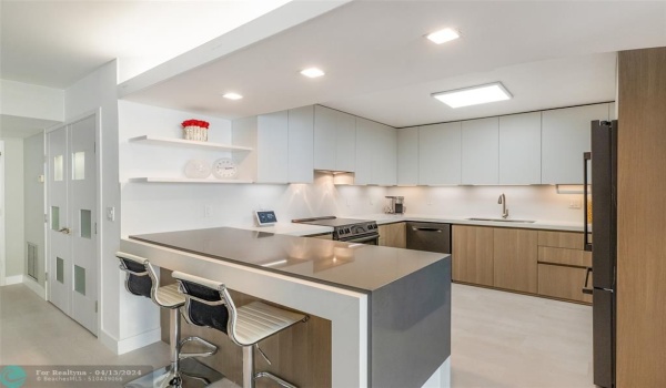 New Kitchen with waterfall quartz counters