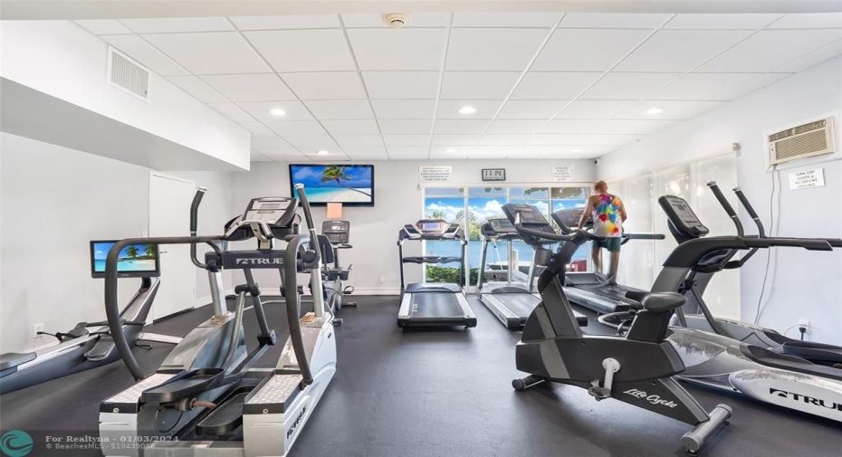 Fitness center with water view