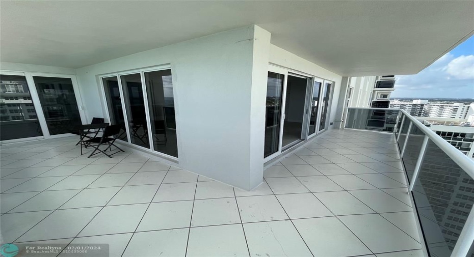 The wraparound balcony offers sliding glass doors with two separate doorways to the balcony.