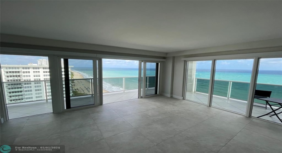 The impact sliding glass doors open to allow the sounds of the ocean and fresh breezes enter the condominium.