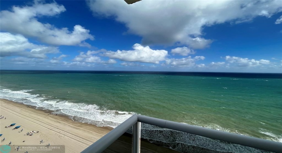 The NE edge of the wraparound balcony showing the unobstructed view of the ocean and beach.