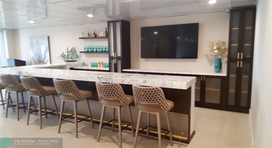The community room includes a bar for special occasions.