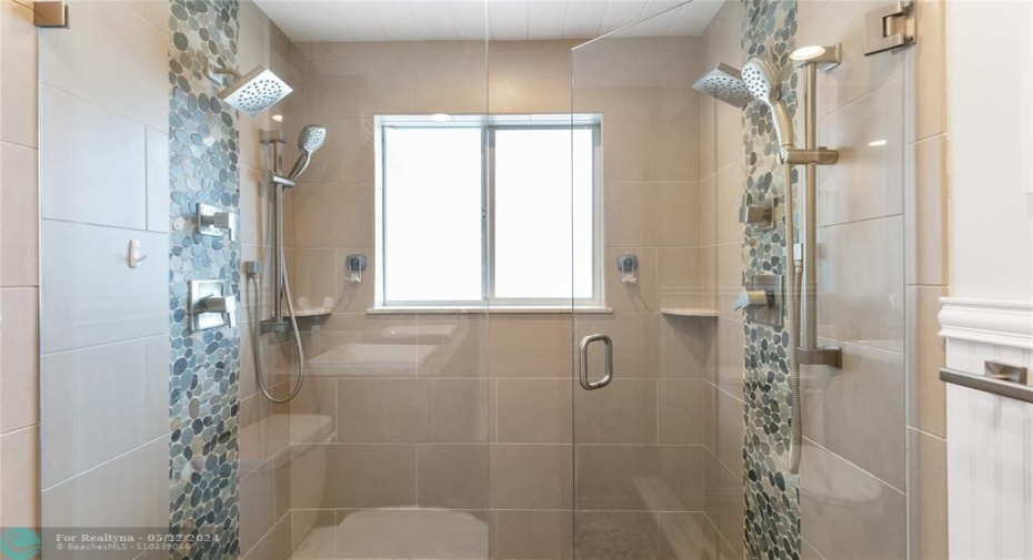 Shower with glass doors, double shower heads.