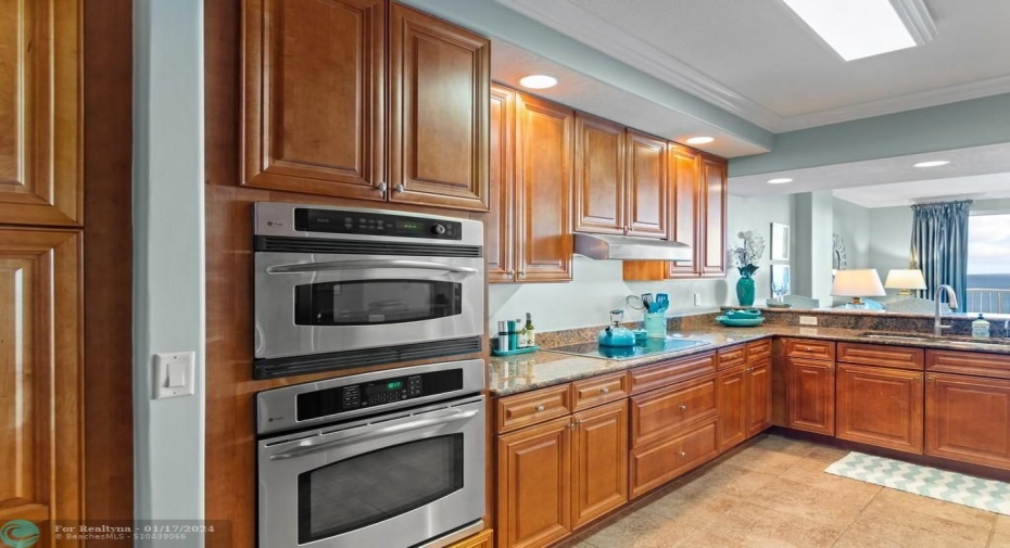 Granite countertops and stainless steel appliances.