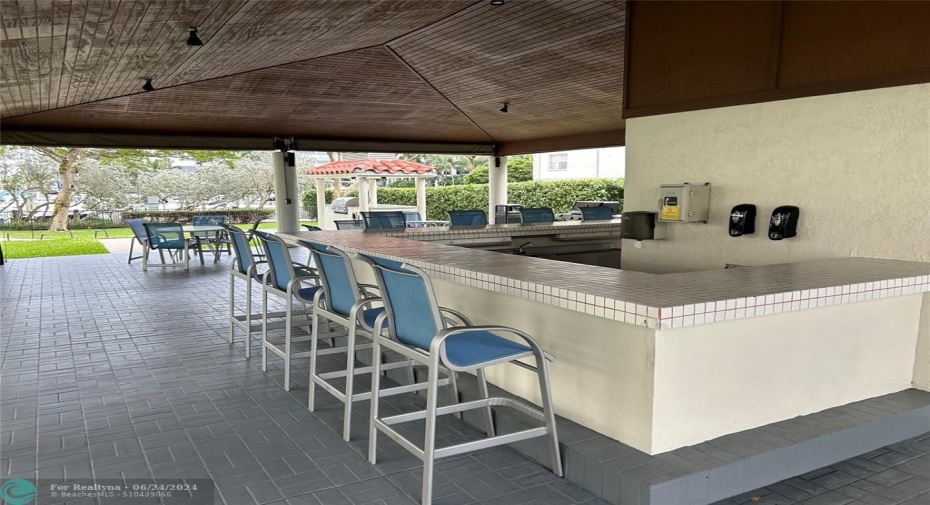 Covered, lighted BBQ Area and kitchen overlooking the marina
