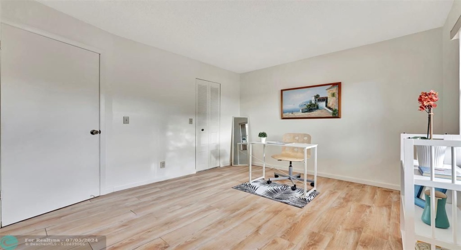 Spacious 2nd bedroom with laminate flooring.