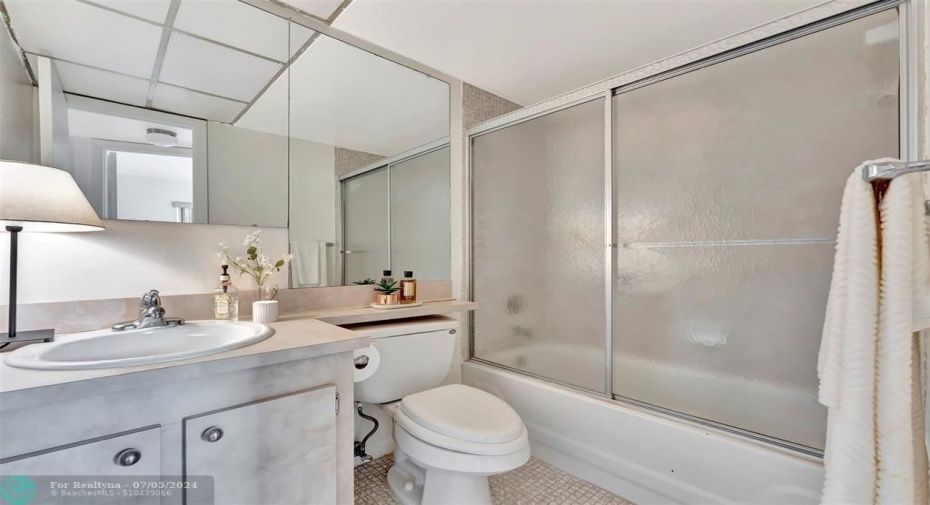 2nd Bathroom with tub, shower, vanity.