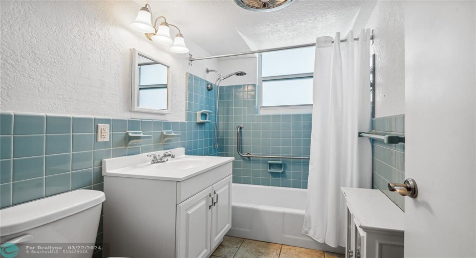 Large, bright bathroom with brand new ADA compliant toilet.