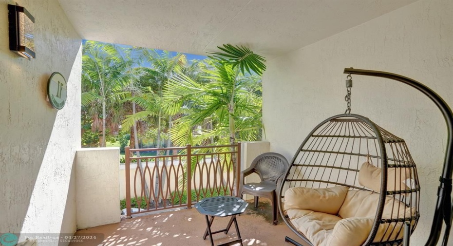 Inviting covered patio just off of the kitchen at rear of unit.