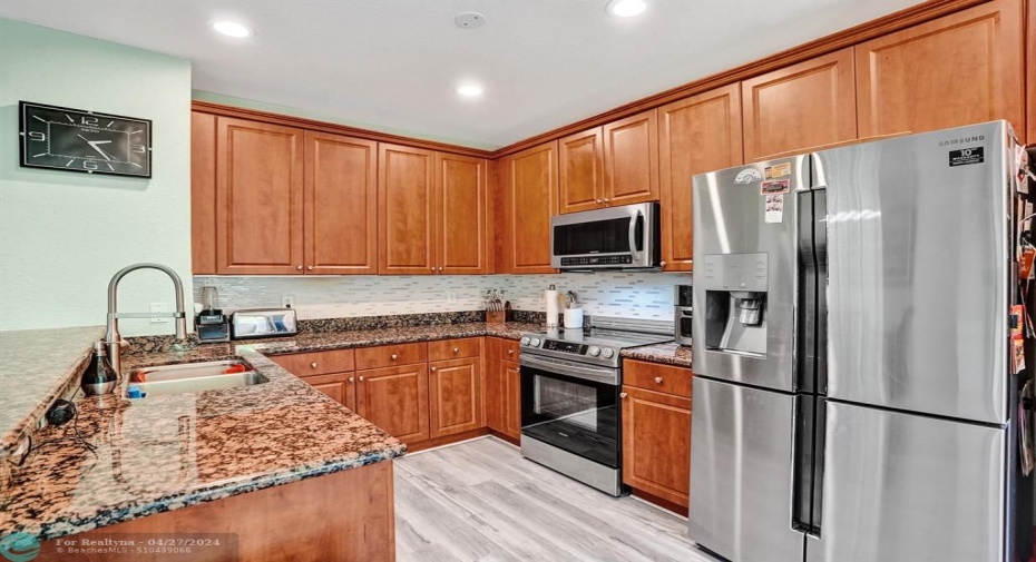 Newer stainless steel appliances, double sink and garbage disposal.