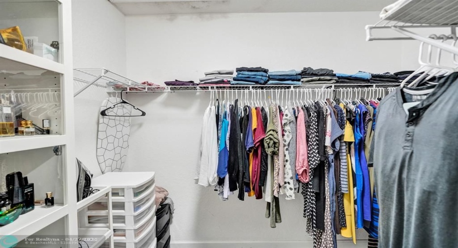 Walk-in custom designed closet in master bedroom.