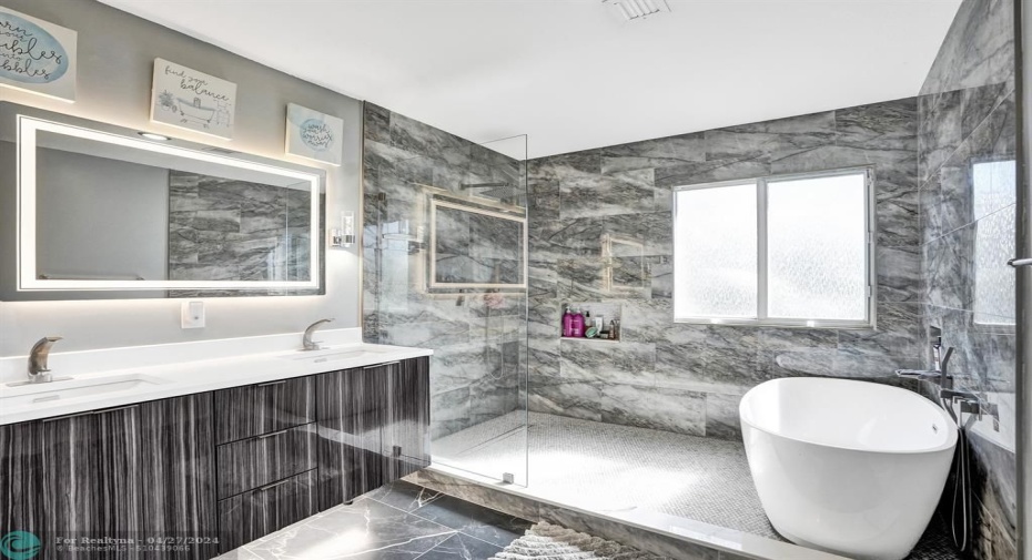 Beautifully upgraded master bathroom with huge-walk-in shower and tub.
