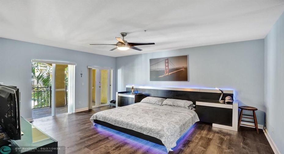 Spacious and light master bedroom with adjoining balcony