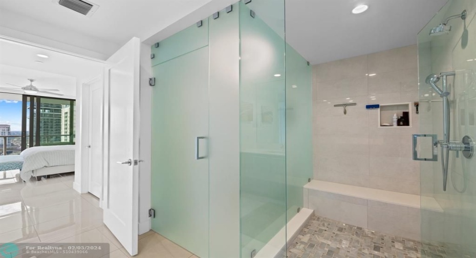 MASTER BATH WITH FROSTED AND CLEAR GLASS ENCLOSURES ... UPGRADED HERRING BONE FLOOR